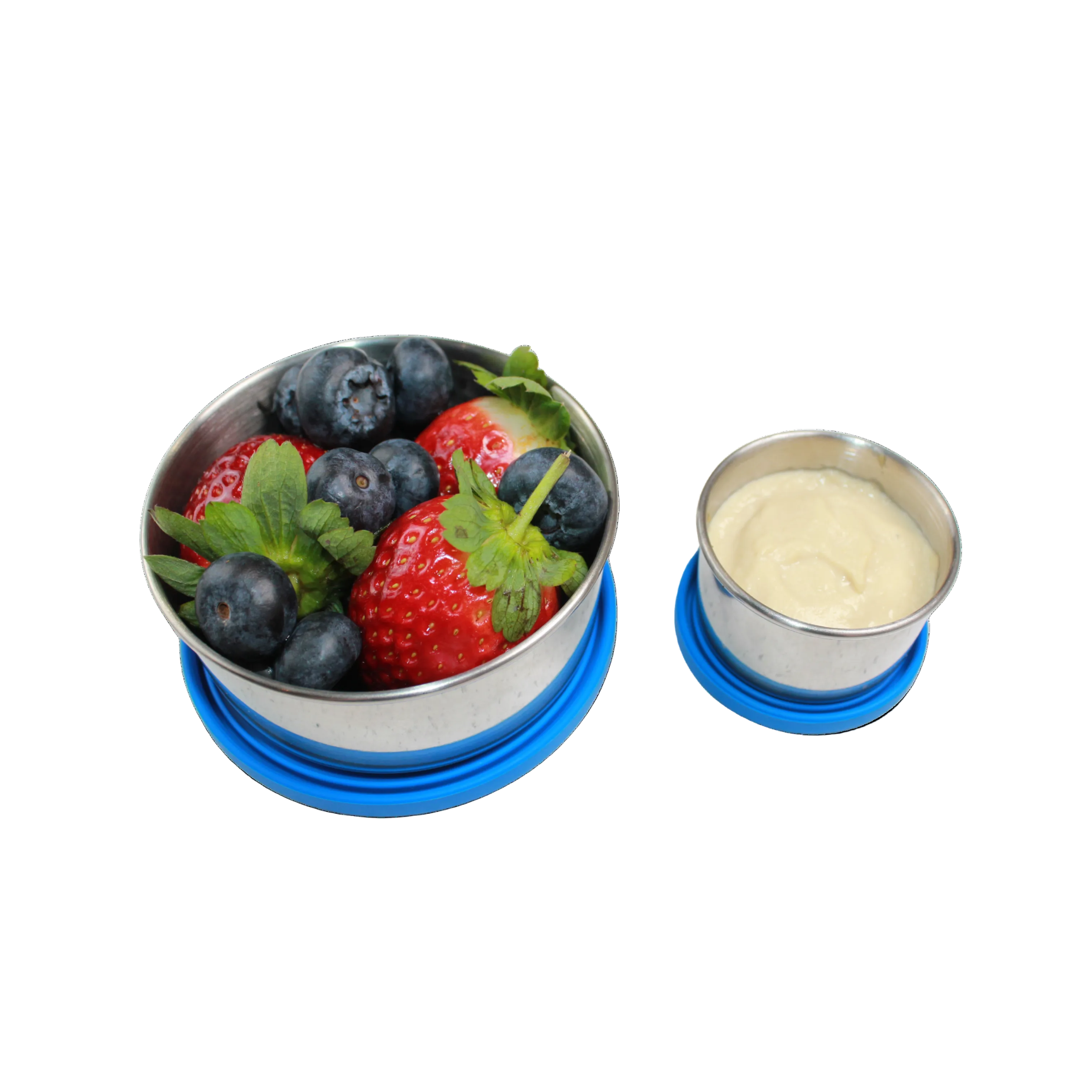 Metal container with berries and a small cup of hommus on a white background